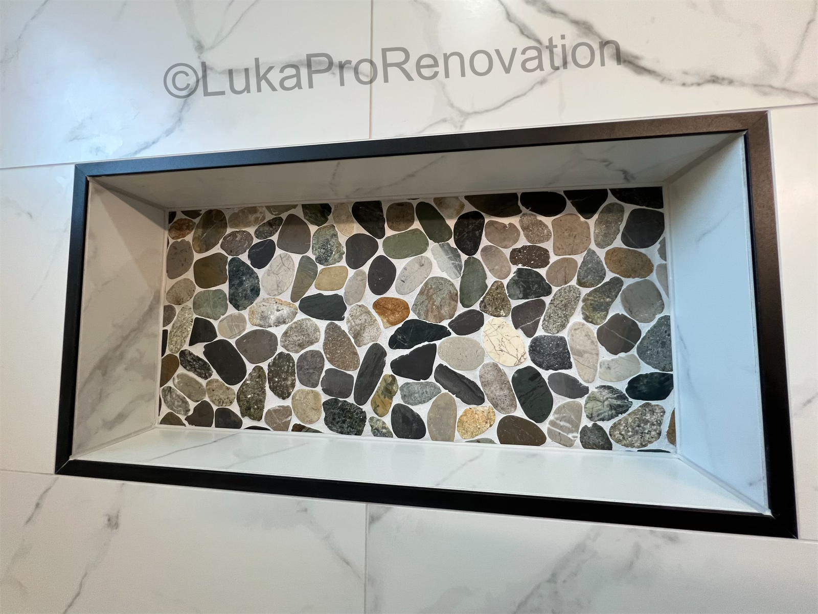 River stone shower niche detail
