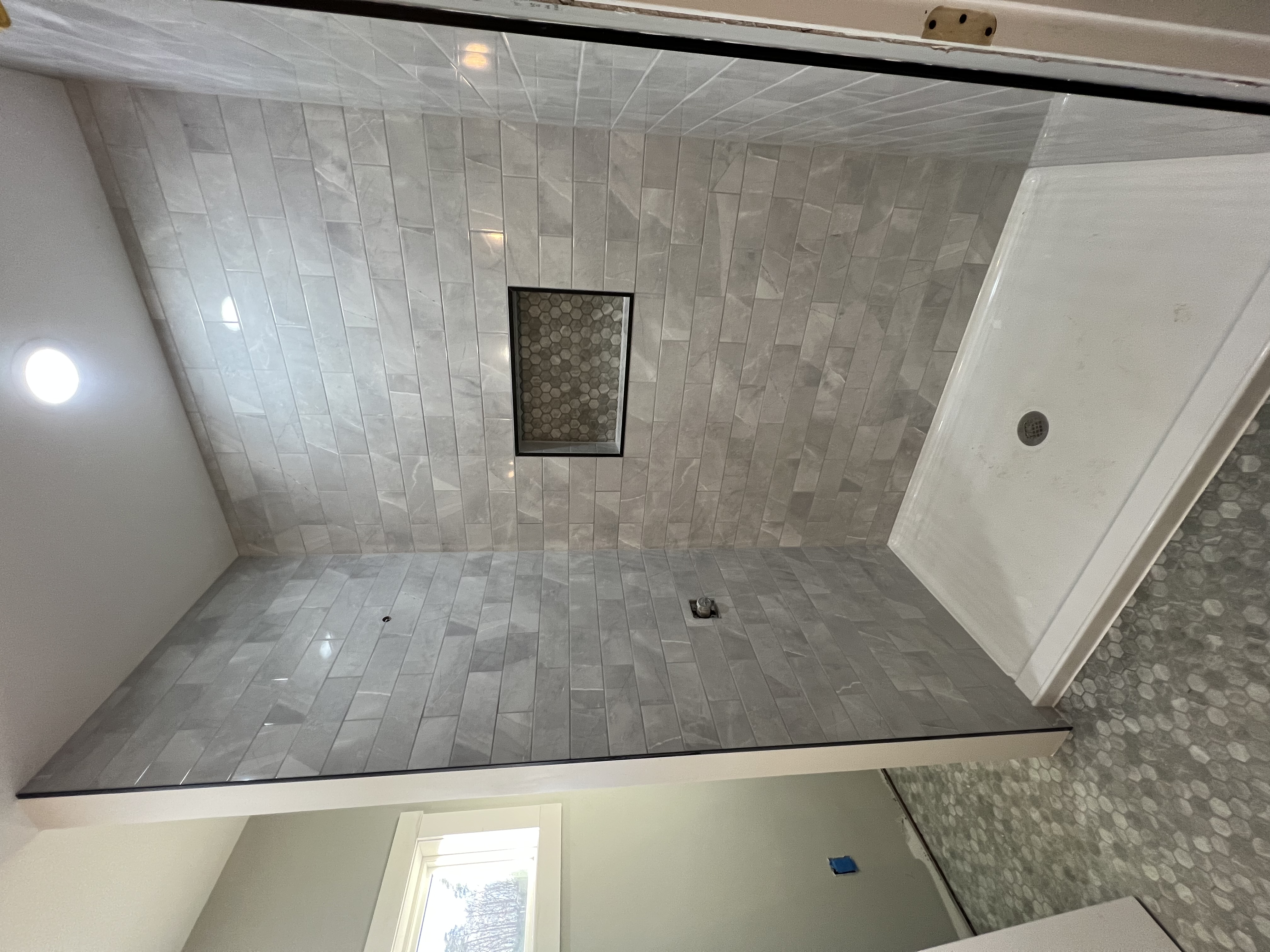 Gray marble subway tile shower