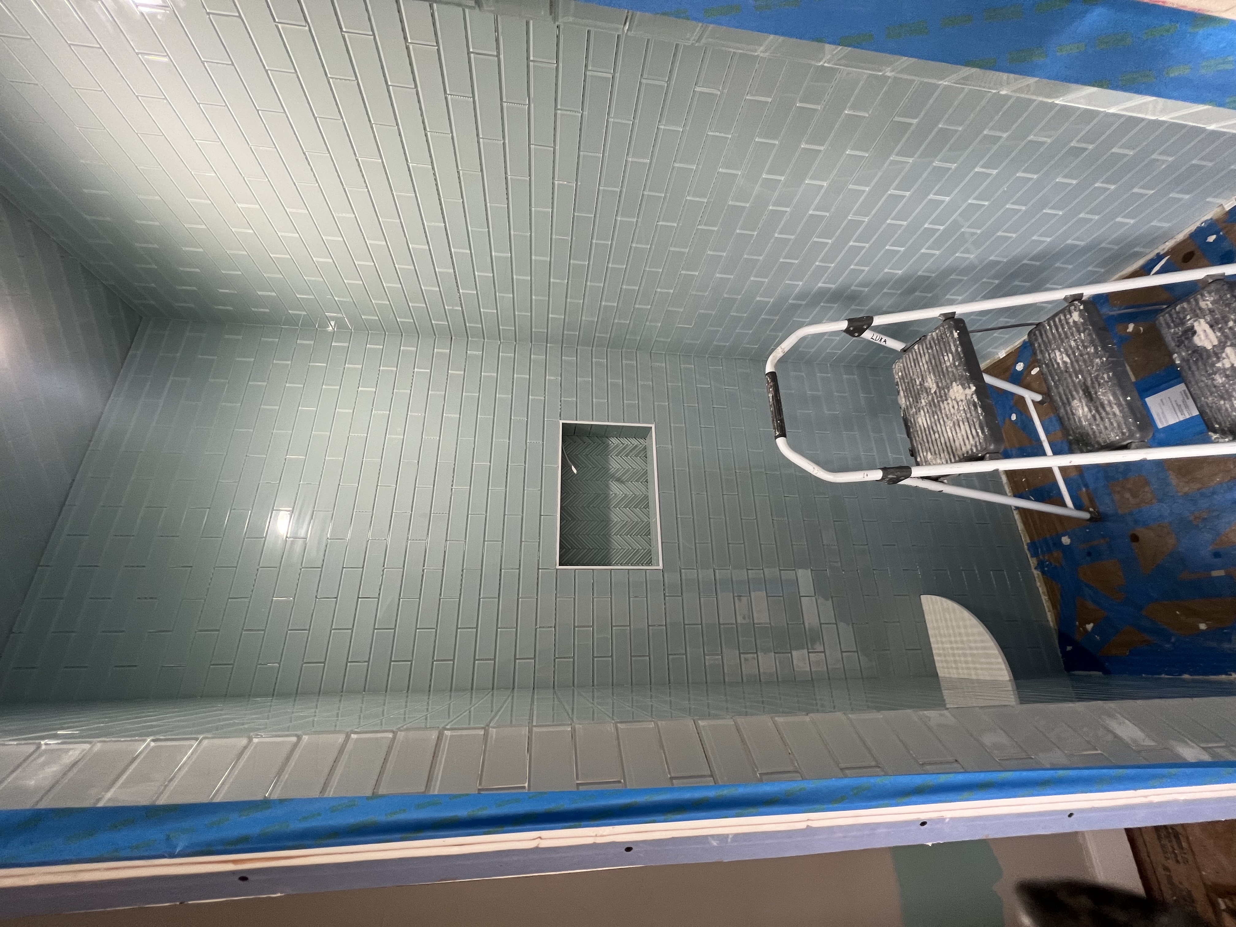 Teal glass tile shower